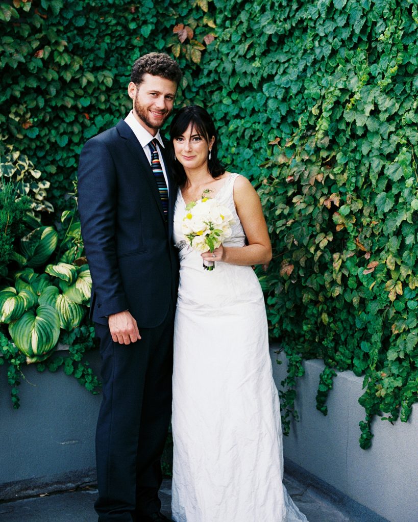 modern jewish wedding couple smiling ny garden